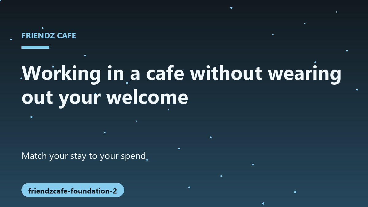 A focused individual typing on a laptop at a small cafe table with a cup of espresso